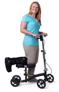 Lady in a crutch on a knee walker