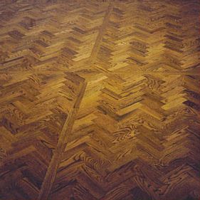 Oak herringbone parquet with a light-brown stain